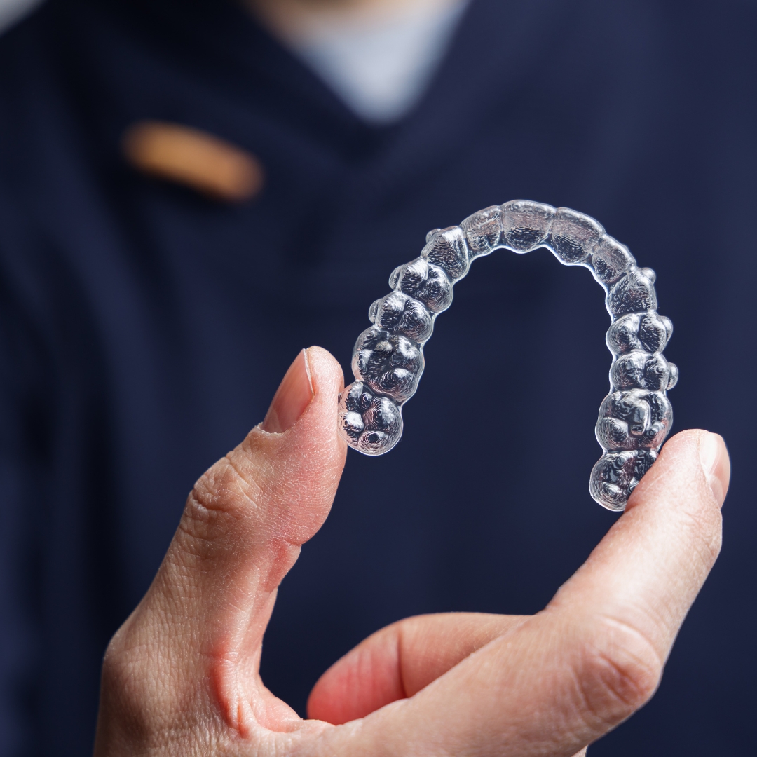 Patient with a confident smile after dental implant treatment