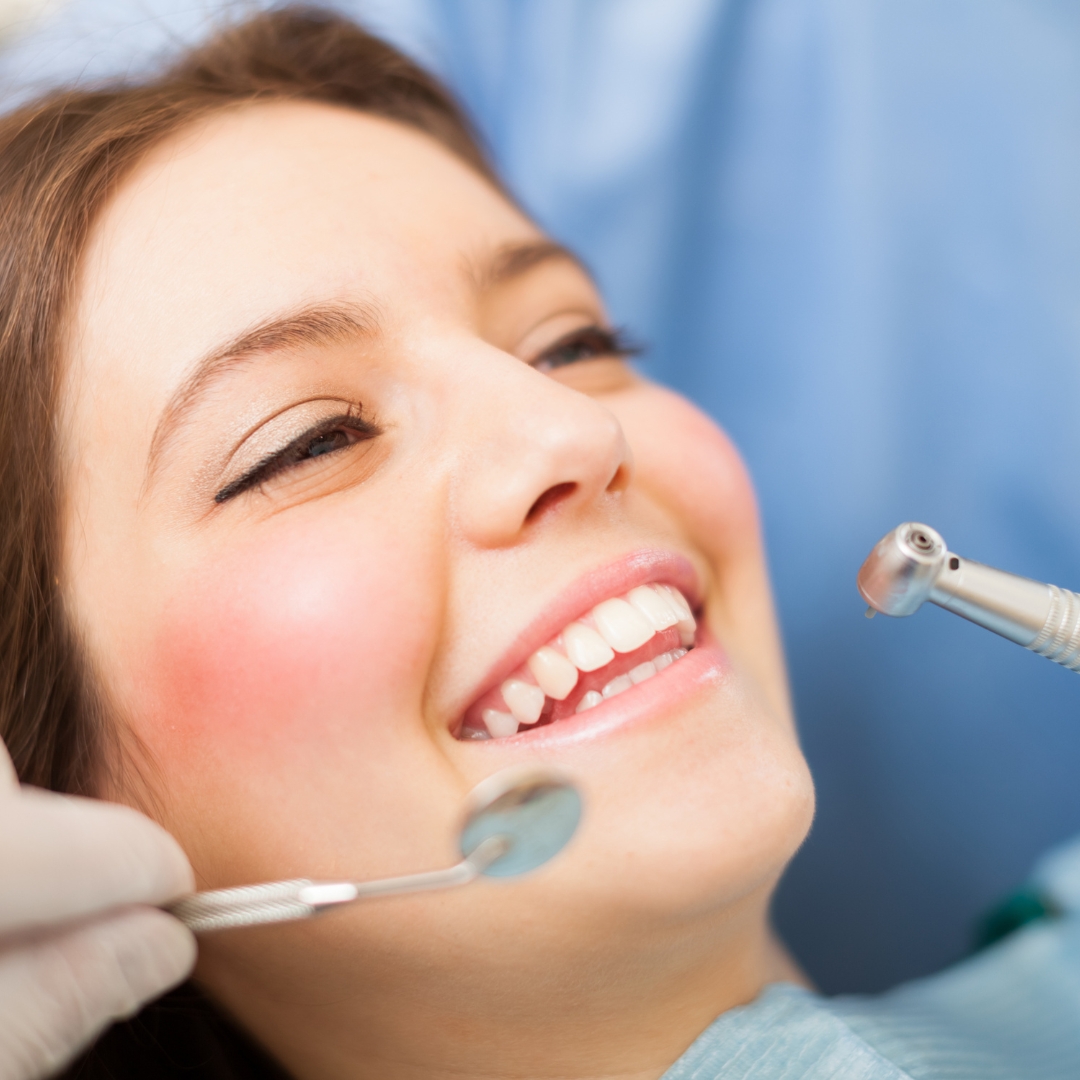Dentist examining patient gum health during hygiene appointment